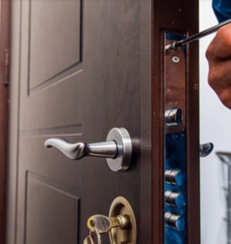 Locksmith Cary working on a door lock mechanism.