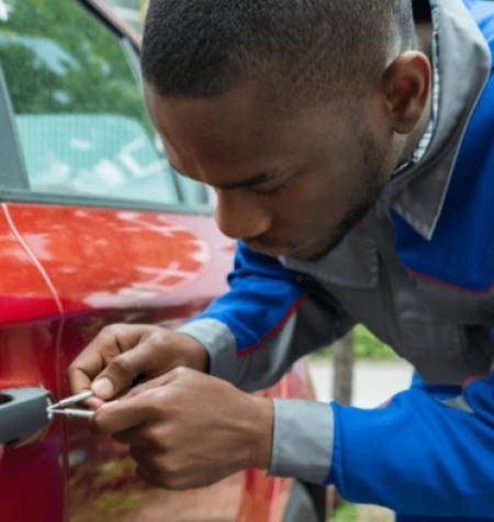 Efficient locksmith at work using specialized tools to provide car lockout services, ensuring quick access and customer satisfaction