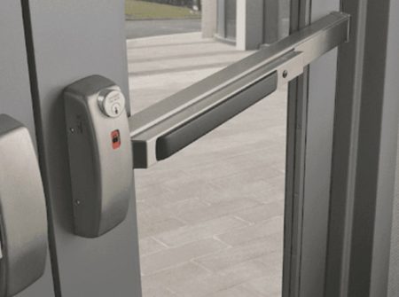 Secure push bar door lock system on a glass door, providing safety and ease of access in commercial settings